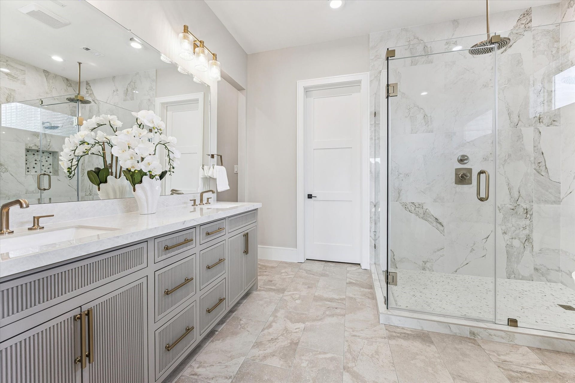 6107 Lake Street, West University Place, TX 77005 Primary bath has large shower with walls of glass.