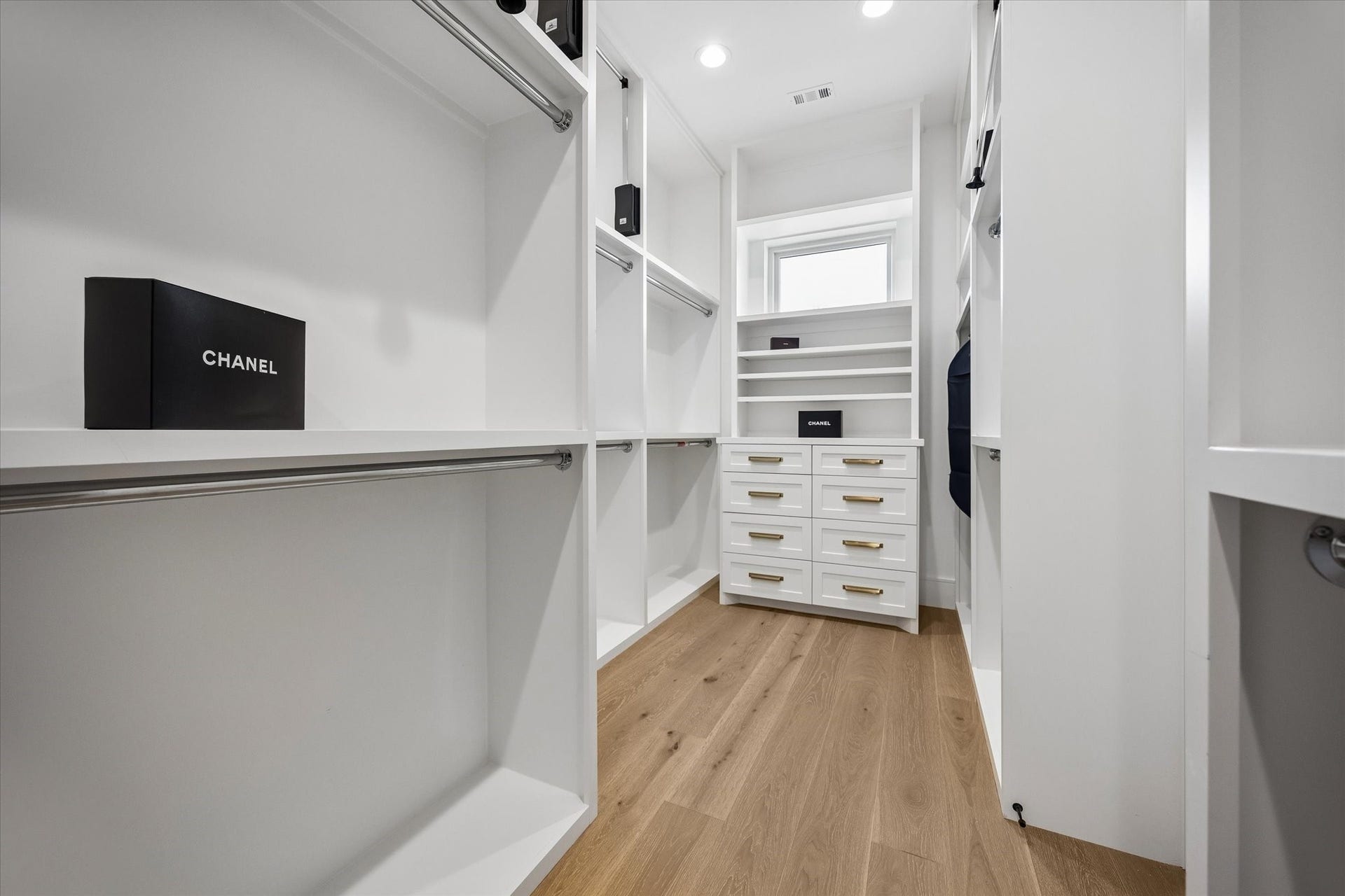 6107 Lake Street, West University Place, TX 77005 Primary walk in closet with built ins.