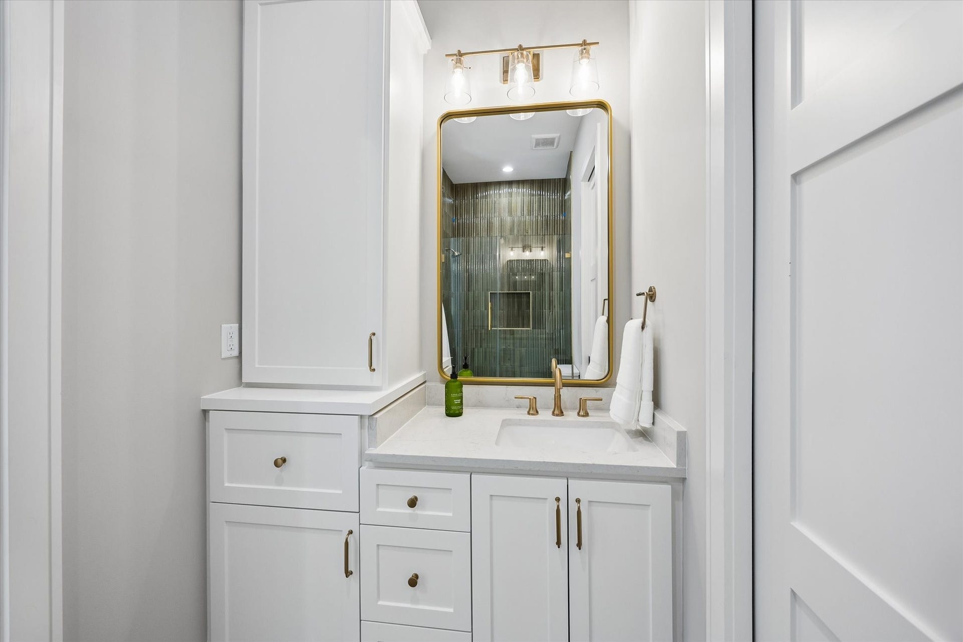 6107 Lake Street, West University Place, TX 77005 Third bedroom bath with great built ins and vanity storage.