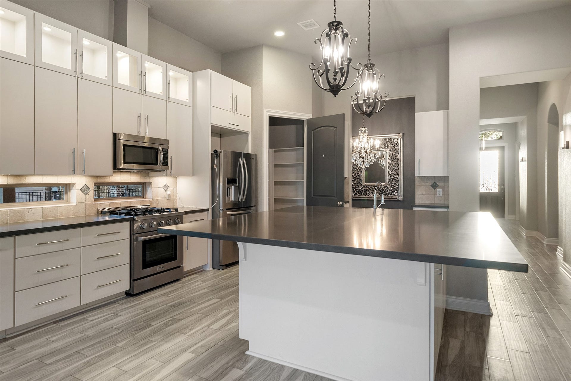 The storage does not disappoint. Enjoy the lighting in the upper cabinets, under the cabinets and recessed lights throughout.