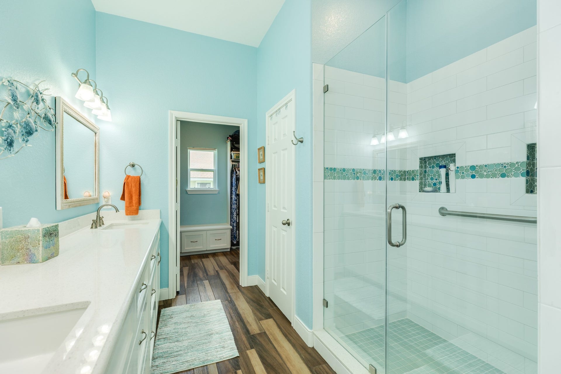 18502 E De Vaca, Galveston, TX 77554 A large walk-in closet is at the end of the first-floor primary bathroom.