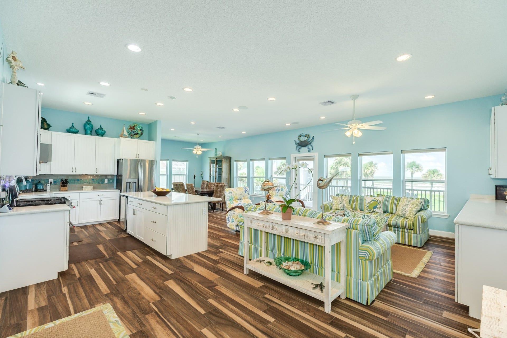 18502 E De Vaca, Galveston, TX 77554 View of the main area of home upon entering. Living room, kitchen and dining area in foreground.
