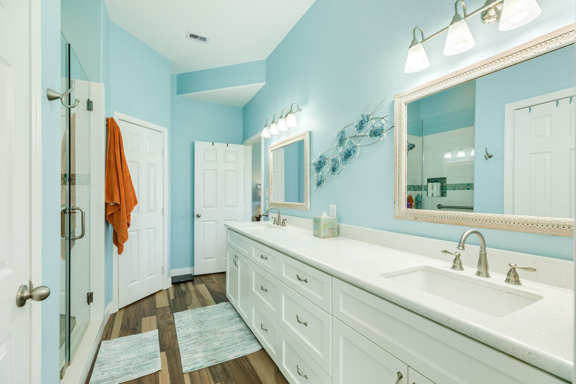 18502 E De Vaca, Galveston, TX 77554 Primary bath includes double vanity sinks, a walk in shower and water closet.