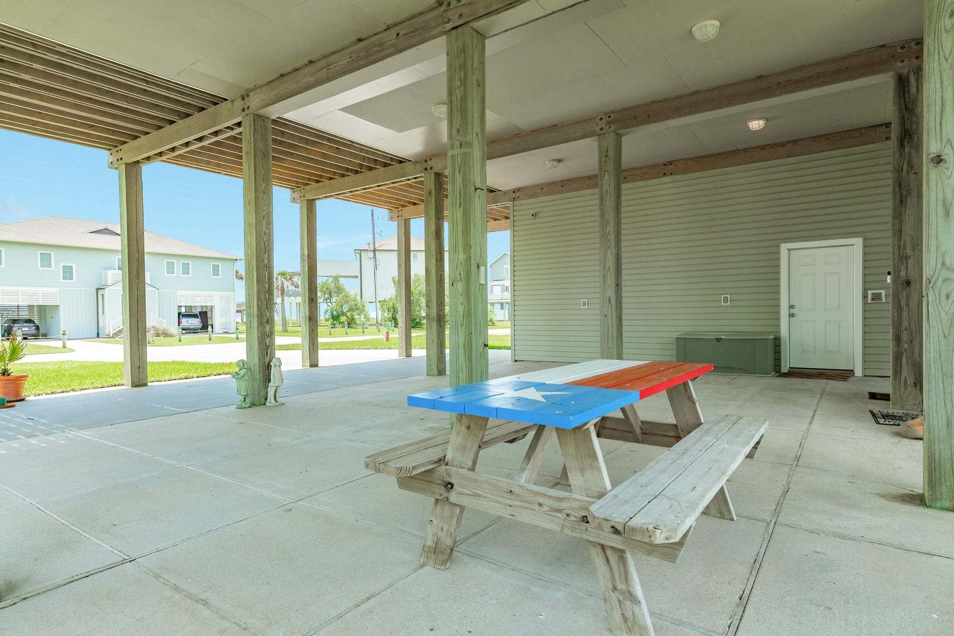 18502 E De Vaca, Galveston, TX 77554 Patio area and pedestrian door into the garage.
