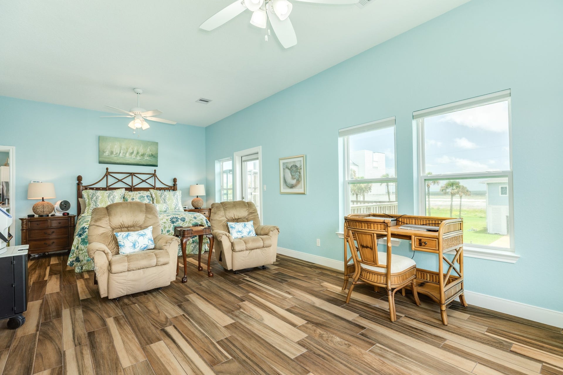 18502 E De Vaca, Galveston, TX 77554 This home has primary suites on each floor. This is the ground floor suite and the room dimensions are 25 x 13, with access to the main deck.