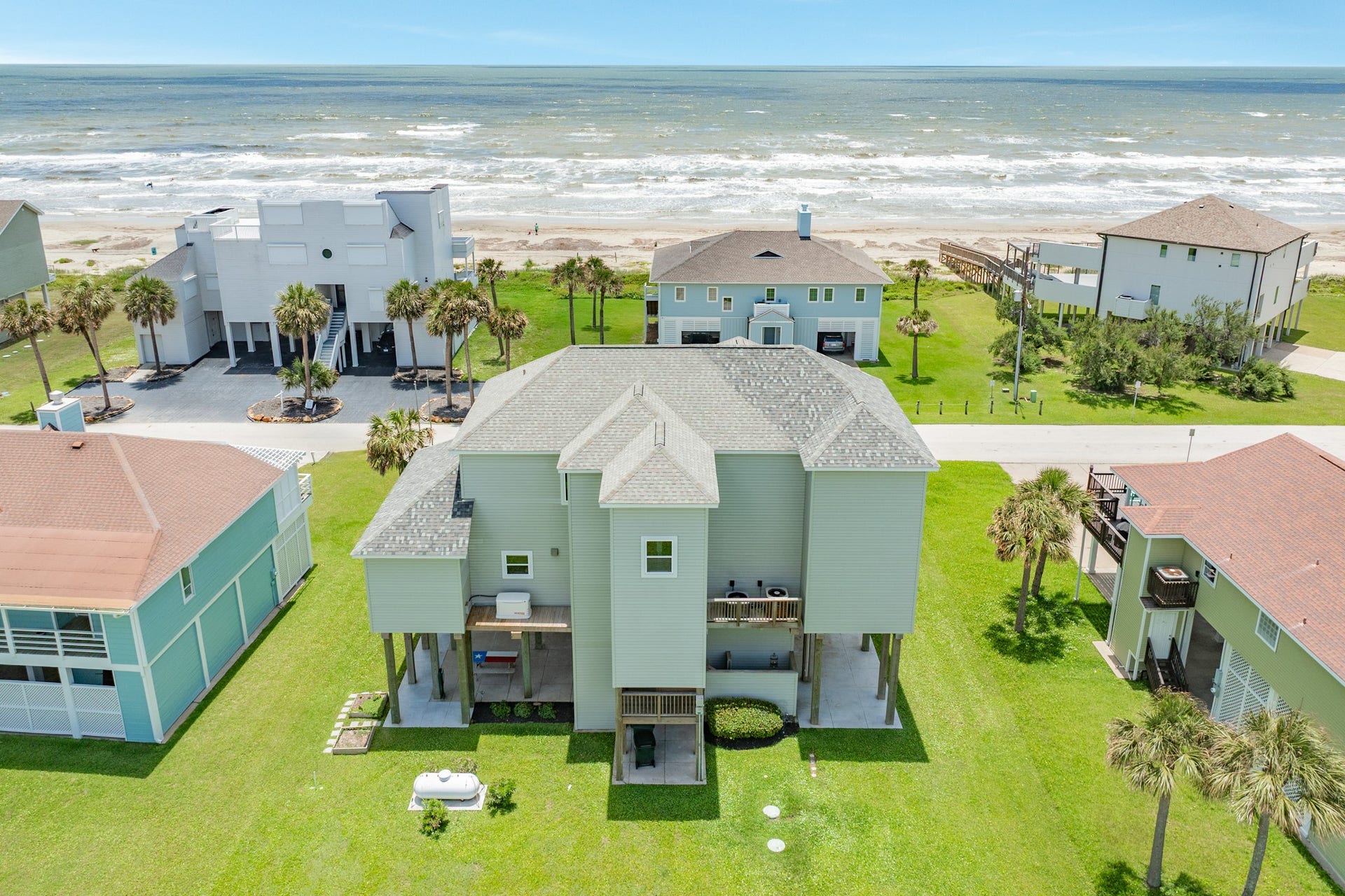 18502 E De Vaca, Galveston, TX 77554 Home has clear views to the gulf between the homes across the street. Generac home generator, and an elevator to all levels on the home.