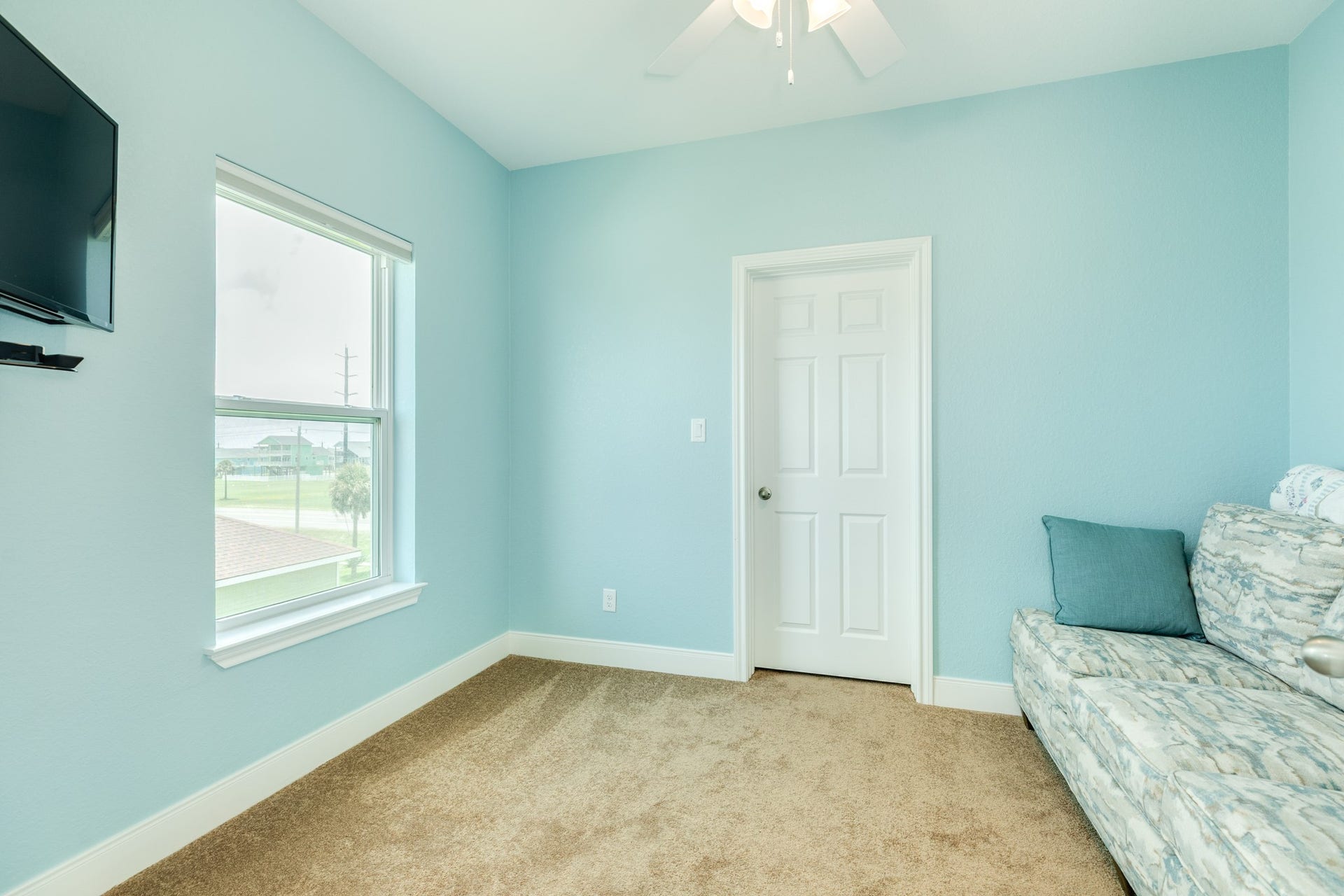 18502 E De Vaca, Galveston, TX 77554 Just off of the upstairs primary bedroom is another room that measures 11x9, is carpeted and the closet is configured with shelves. This room could be used as a nursery, office space, art studio any number of things!