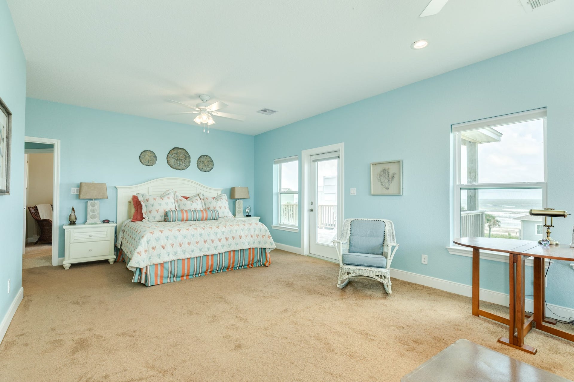 18502 E De Vaca, Galveston, TX 77554 2nd floor primary suite, measures 13 x 24. Currently configured with an office nook at the far end. All bedrooms upstairs have deck access.