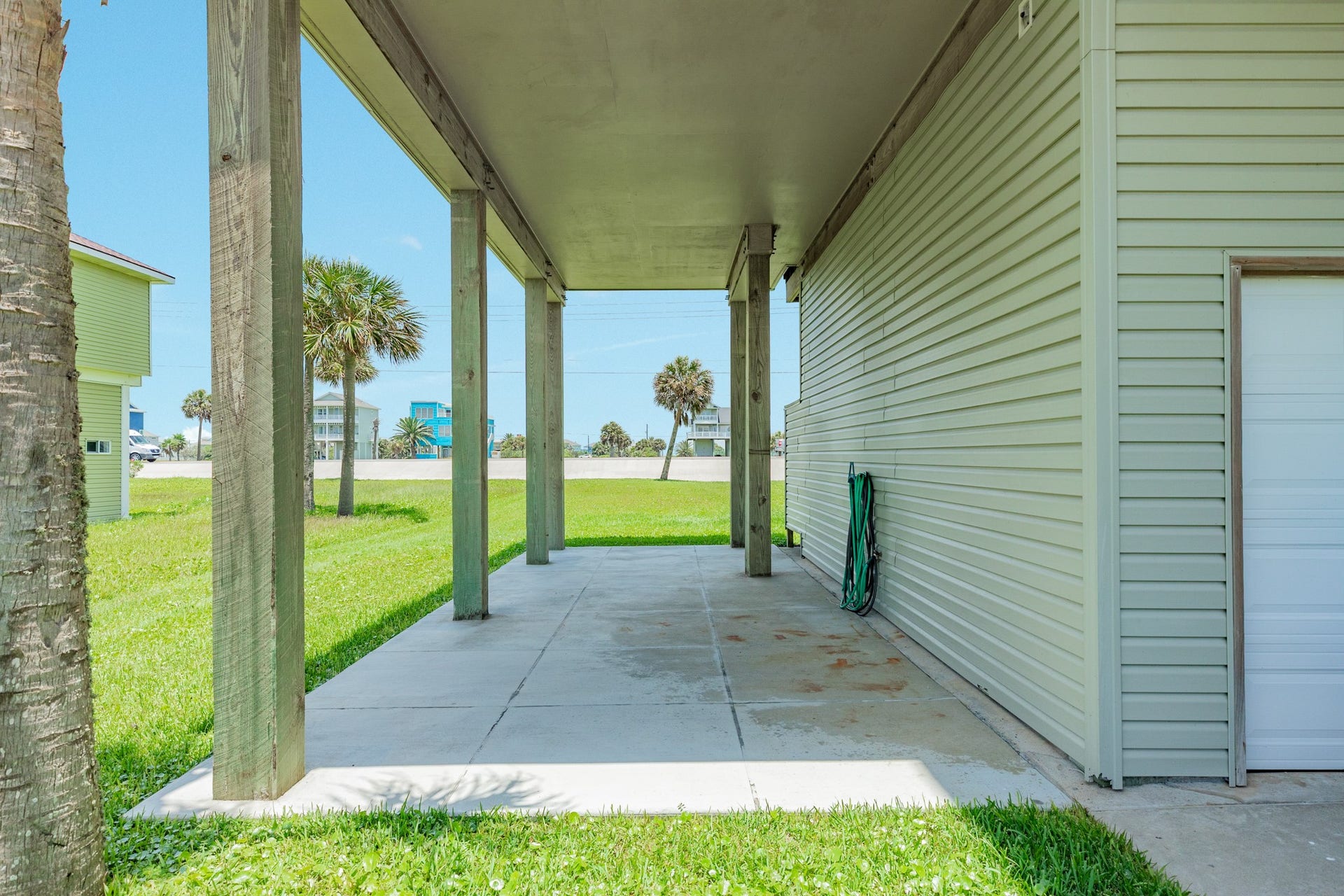 18502 E De Vaca, Galveston, TX 77554 Side patio area under the western addition to the home added in 22/23.