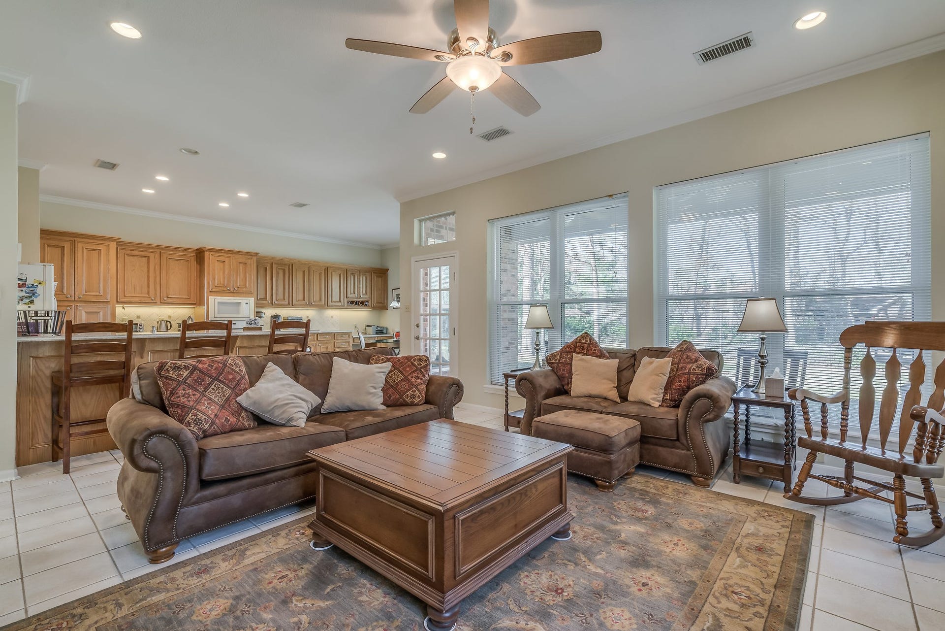 2500 Centerline Road, Conroe, TX 77384 Inviting living space seamlessly blends comfort and style, offering expansive windows that showcase stunning backyard views, perfect for relaxation and entertaining
