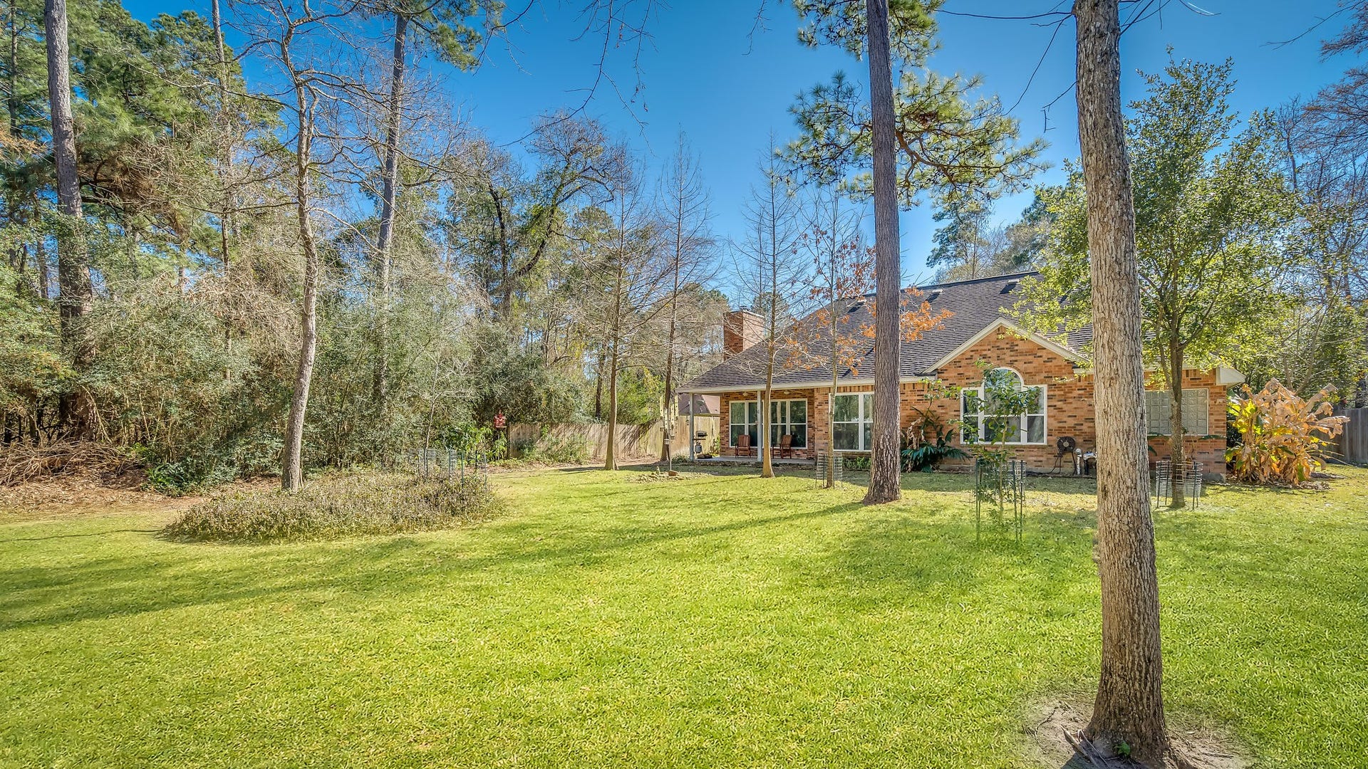 2500 Centerline Road, Conroe, TX 77384 Discover the perfect blend of nature and potential in this expansive backyard, offering ample space to create your dream oasis, complete with room for a pool