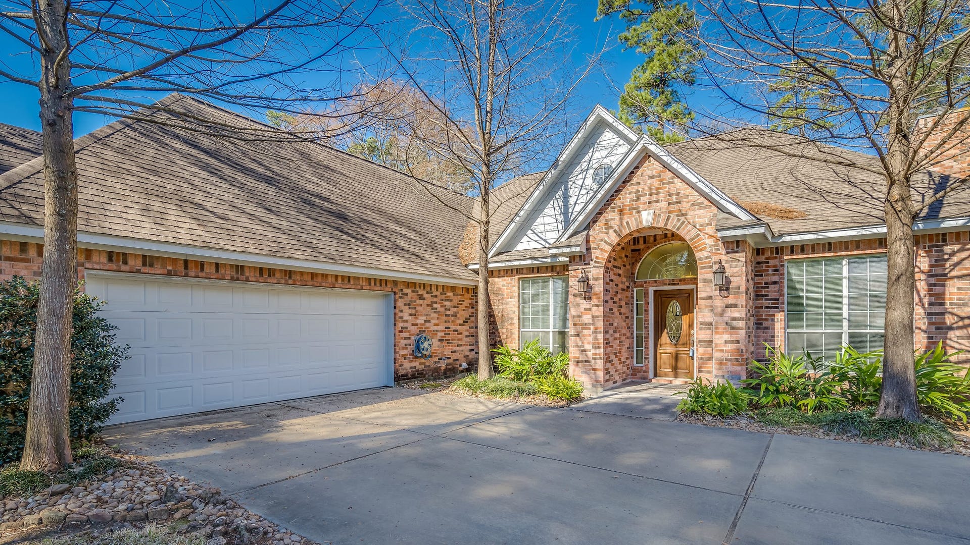 2500 Centerline Road, Conroe, TX 77384 Home features a welcoming covered entry, an oversized sideload garage, and ample extra parking b
