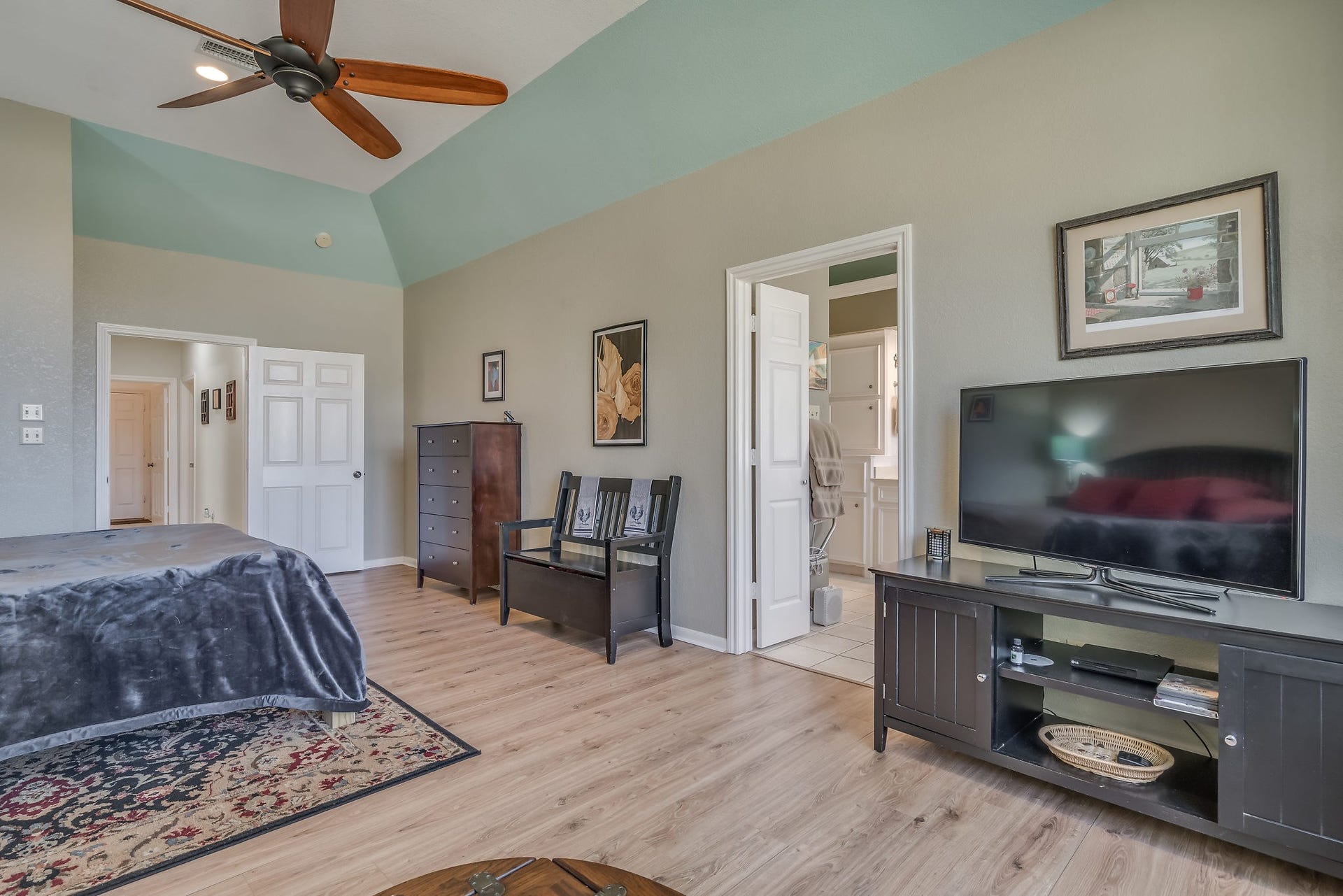 2500 Centerline Road, Conroe, TX 77384 Discover the spacious primary suite featuring stylish laminate flooring, offering a perfect blend of comfort and elegance