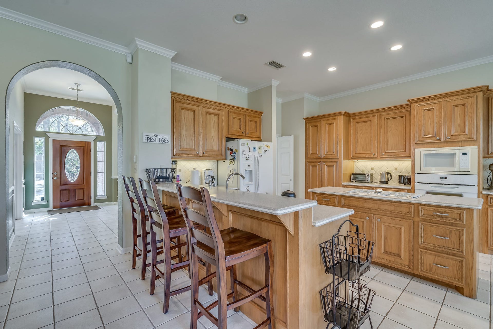 2500 Centerline Road, Conroe, TX 77384 Discover culinary delight in this gourmet kitchen, featuring abundant cabinetry, a spacious island, and an oversized breakfast bar perfect for eating small meals or displaying gourmet foods for quests
