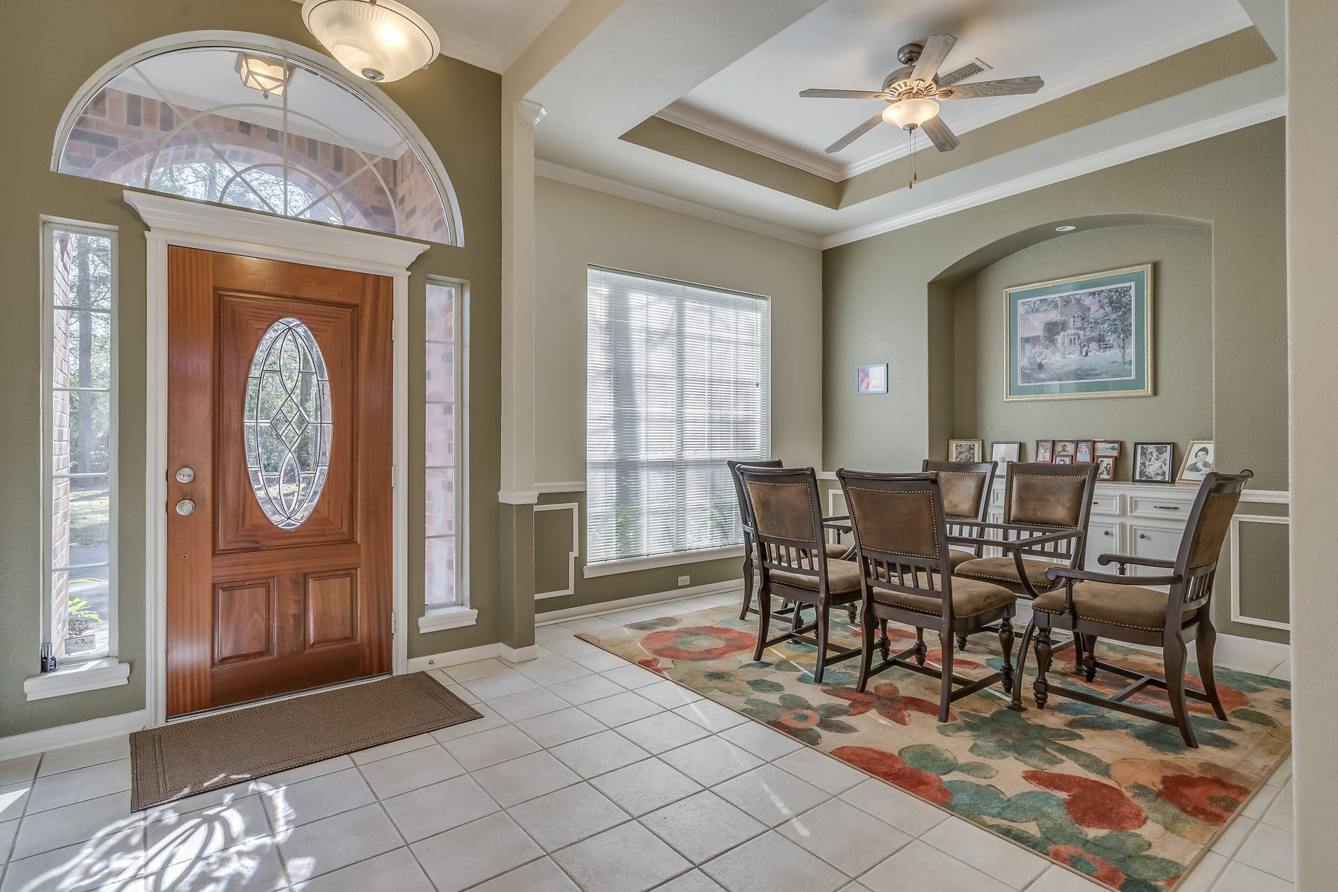 2500 Centerline Road, Conroe, TX 77384 Step into an inviting foyer featuring a stunning leaded glass front door with sidelights and transom, complemented by elegant tiled flooring and warm, welcoming colors throughout