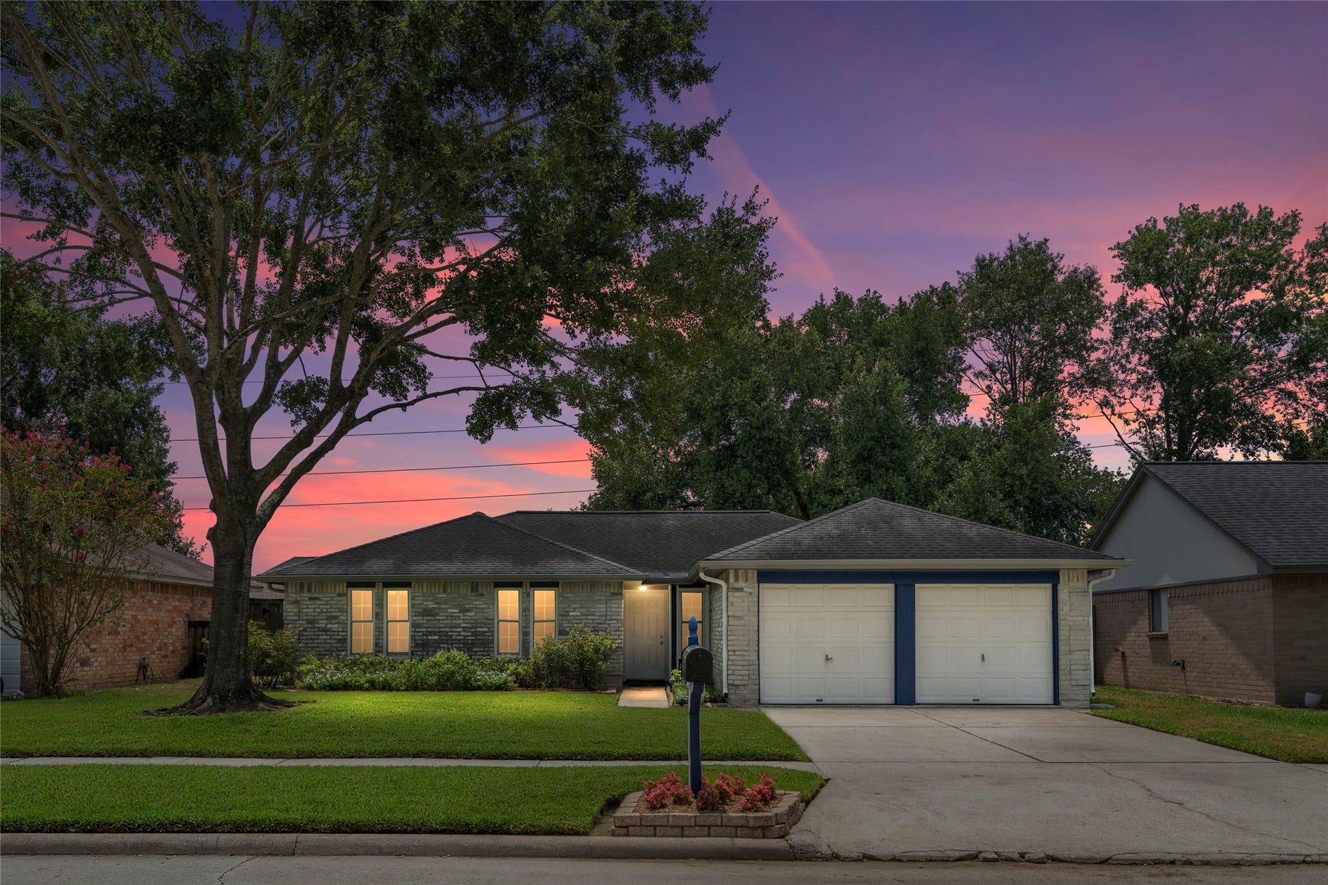 4715 Roserock Lane, Spring, TX 77388 Incredible curb appeal at sunset! Welcome to a charming single-story home framed by mature oak trees.