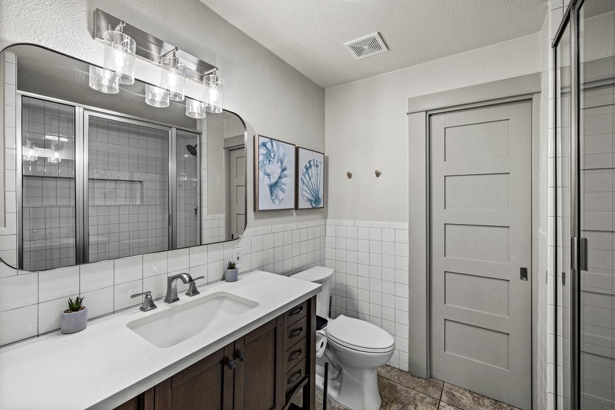 1414 29th Street, Galveston, TX 77550 Primary Bathroom #1- Updated private bathroom with large shower w/ dual shower heads