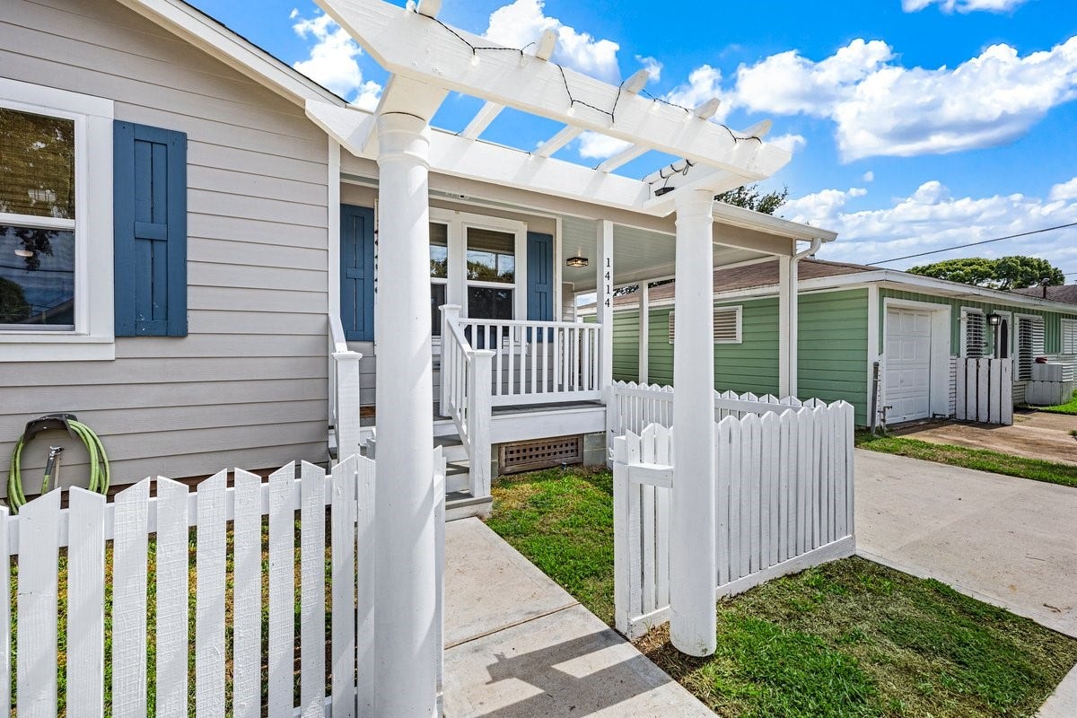 1414 29th Street, Galveston, TX 77550 Charming garden arbor entrance adds a welcoming touch to this beautifully remodeled Galveston home.