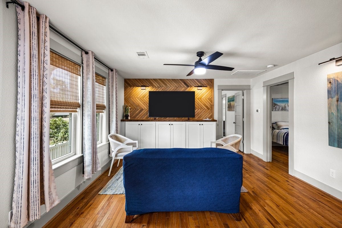 1414 29th Street, Galveston, TX 77550 Stunning wood feature wall creates a warm, inviting living room with classic Galveston charm.