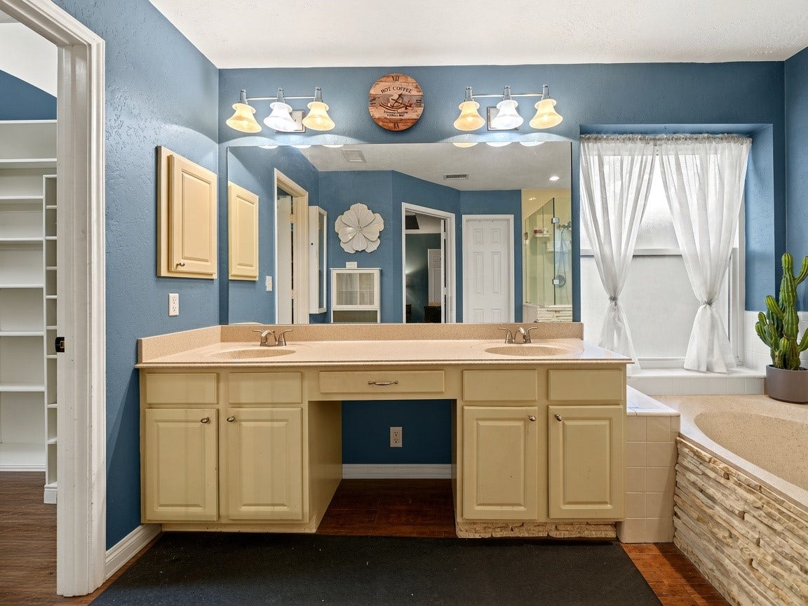 1806 Kensington Park Circle, Spring, TX 77386 Primary bath with dual vanities. Virtually staged.