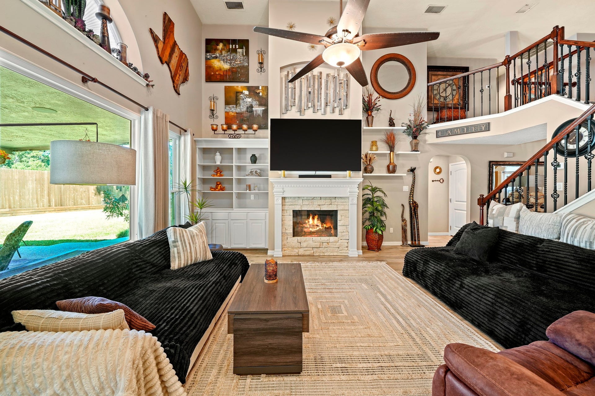 1806 Kensington Park Circle, Spring, TX 77386 Soaring living room with stone fireplace. Virtually staged.