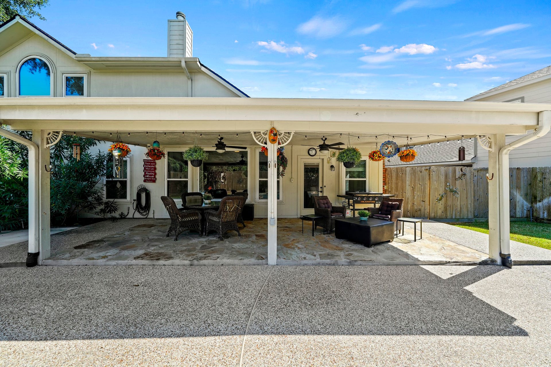 1806 Kensington Park Circle, Spring, TX 77386 Covered patio with outdoor dining space.