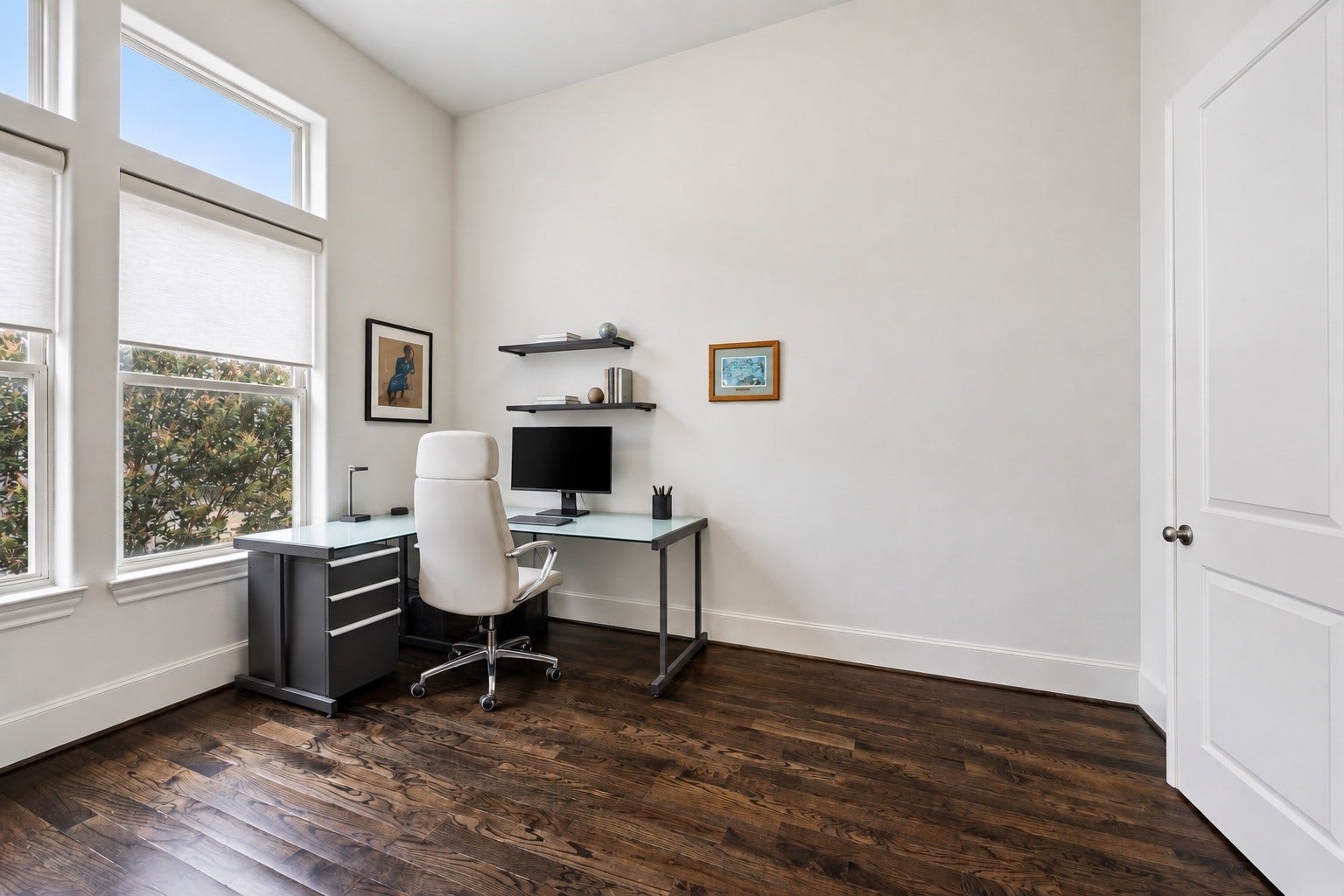 2725 Cohn Garden, Houston, TX 77007 Soaring ceilings and oversized windows fill this dedicated home office with natural light, while rich hardwood floors bring warmth to the bright, airy space. Generous proportions leave room to create a polished workspace tailored to your needs.