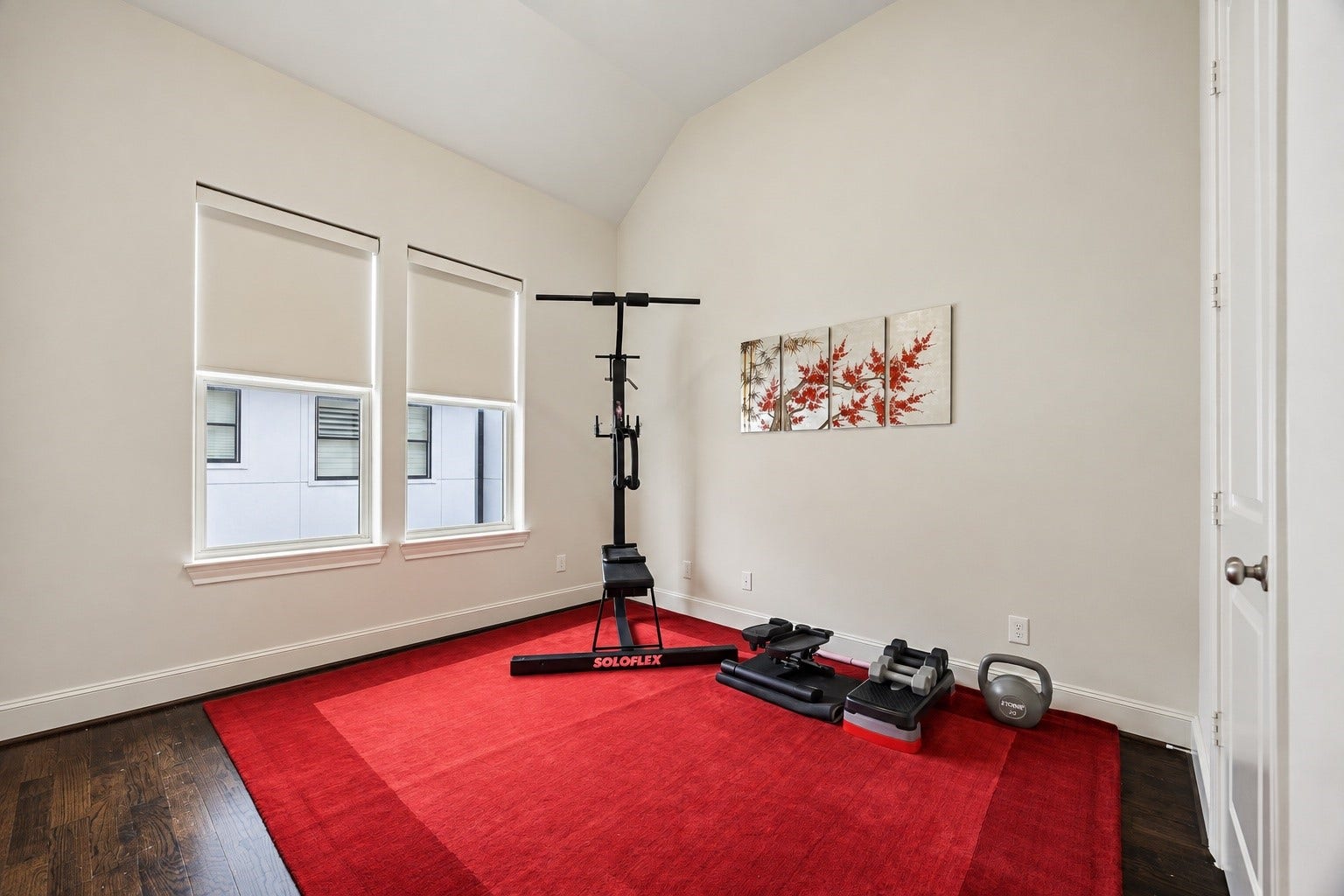 2725 Cohn Garden, Houston, TX 77007 Vaulted ceilings and natural light give this secondary bedroom an airy sense of space, with rich hardwood floors adding warmth throughout. Its generous footprint offers plenty of flexibility for a bedroom, fitness space, or combination of both.