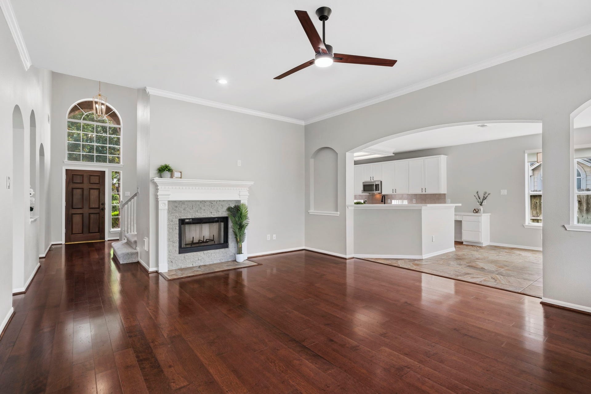 3427 Powell Way, Missouri City, TX 77459 Spacious family room with a fireplace and seamless kitchen access.