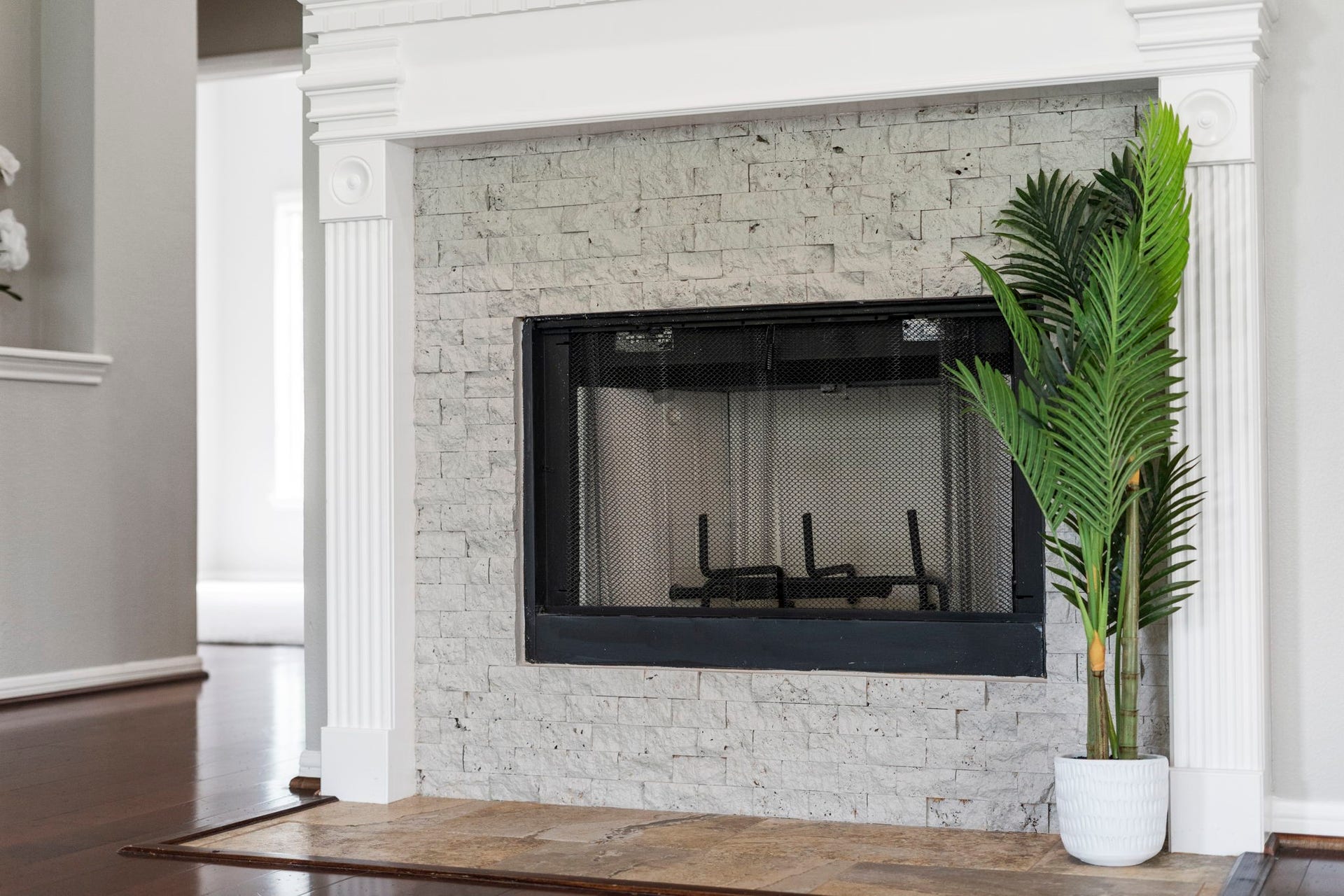 3427 Powell Way, Missouri City, TX 77459 Inviting fireplace with classic architectural detailing.
