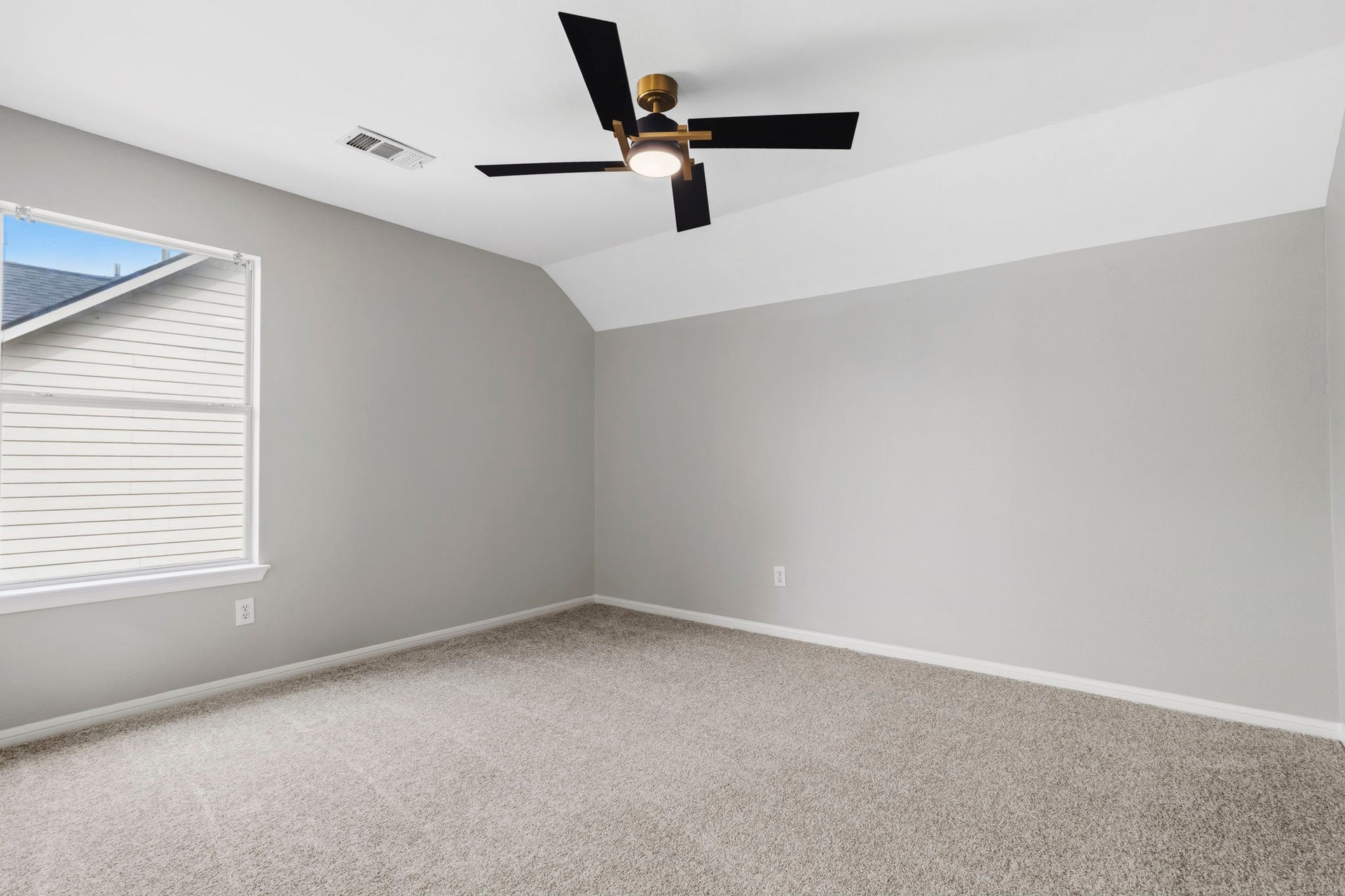 3427 Powell Way, Missouri City, TX 77459 Spacious bedroom with a vaulted ceiling and natural light.