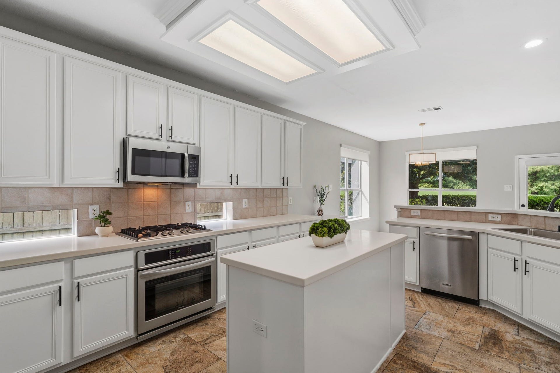 3427 Powell Way, Missouri City, TX 77459 Spacious kitchen with abundant cabinetry, island, and natural light.