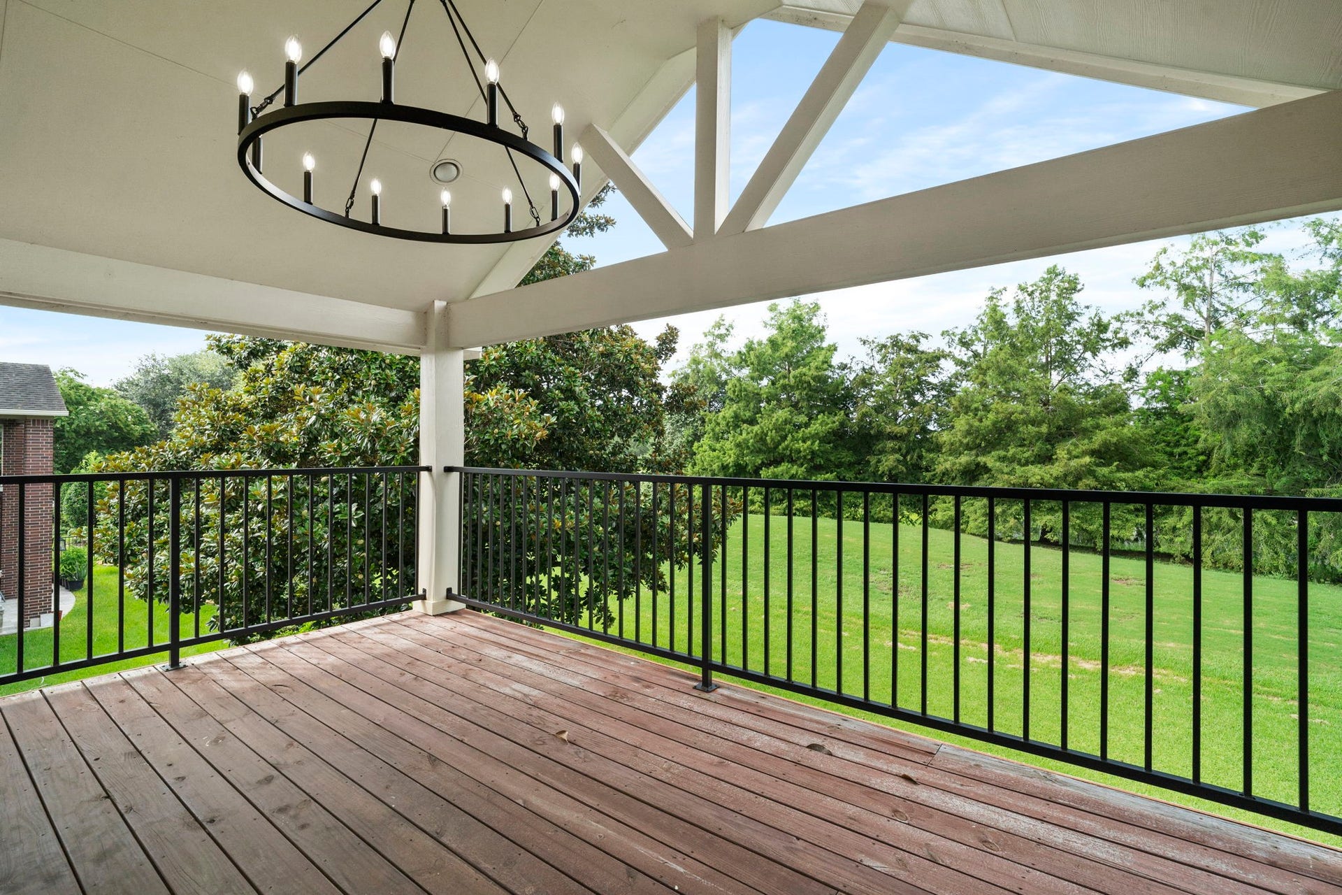 3427 Powell Way, Missouri City, TX 77459 Covered balcony offering peaceful views of the surrounding greenery.