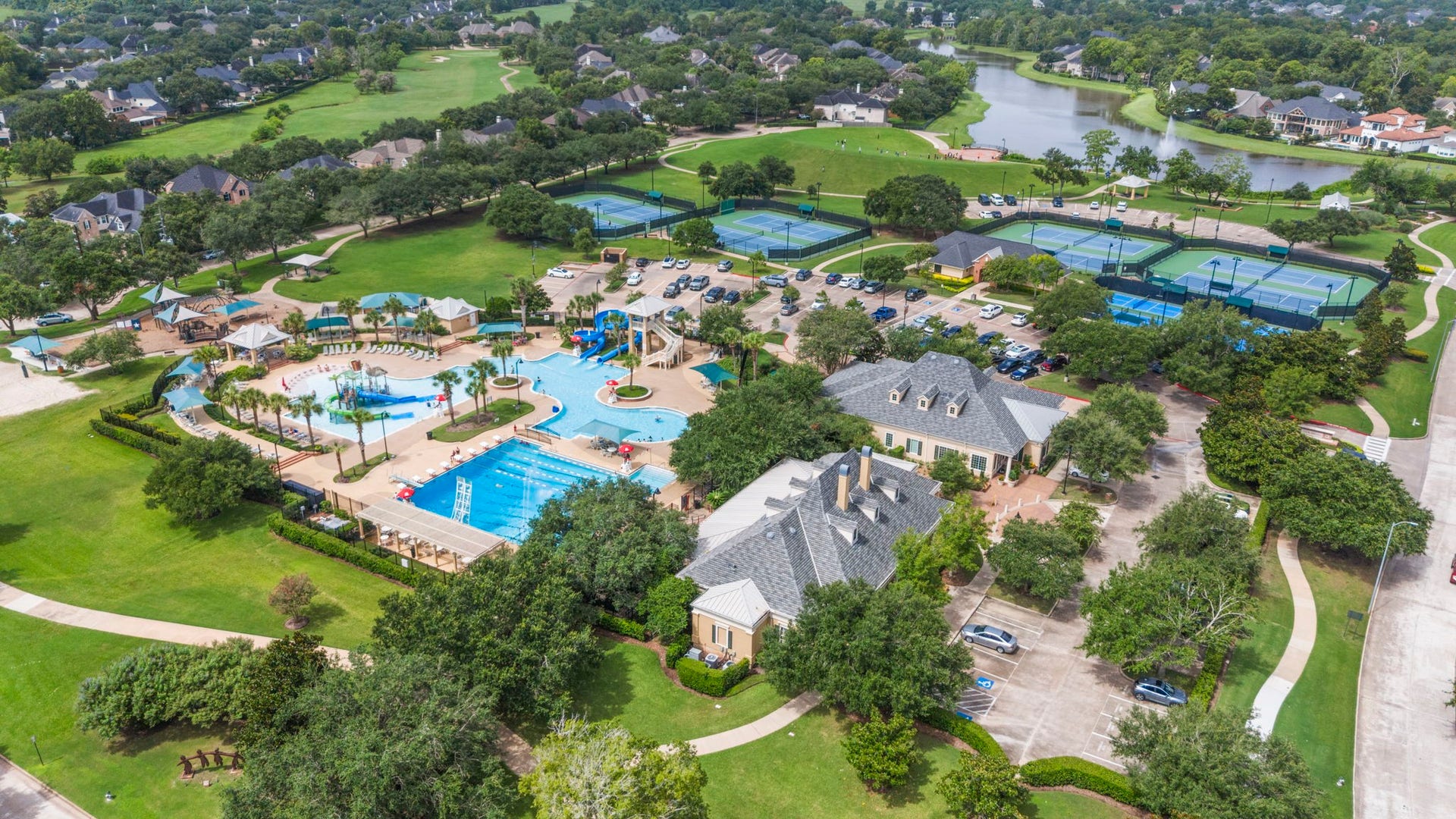 3427 Powell Way, Missouri City, TX 77459 Resort-style community amenities featuring pools, tennis courts, and scenic green spaces.