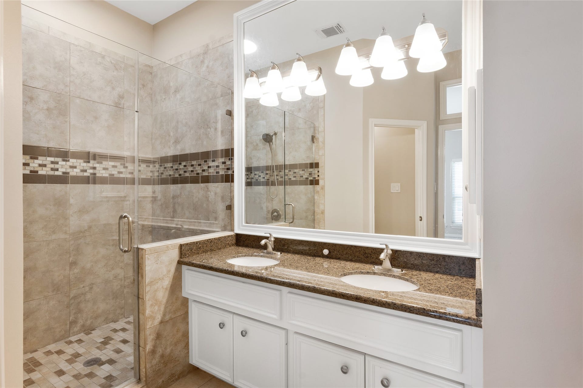 2615 W Dallas Street, Houston, TX 77019 Primary Bath with dual vanity, granite countertop and large walk in tiled shower
