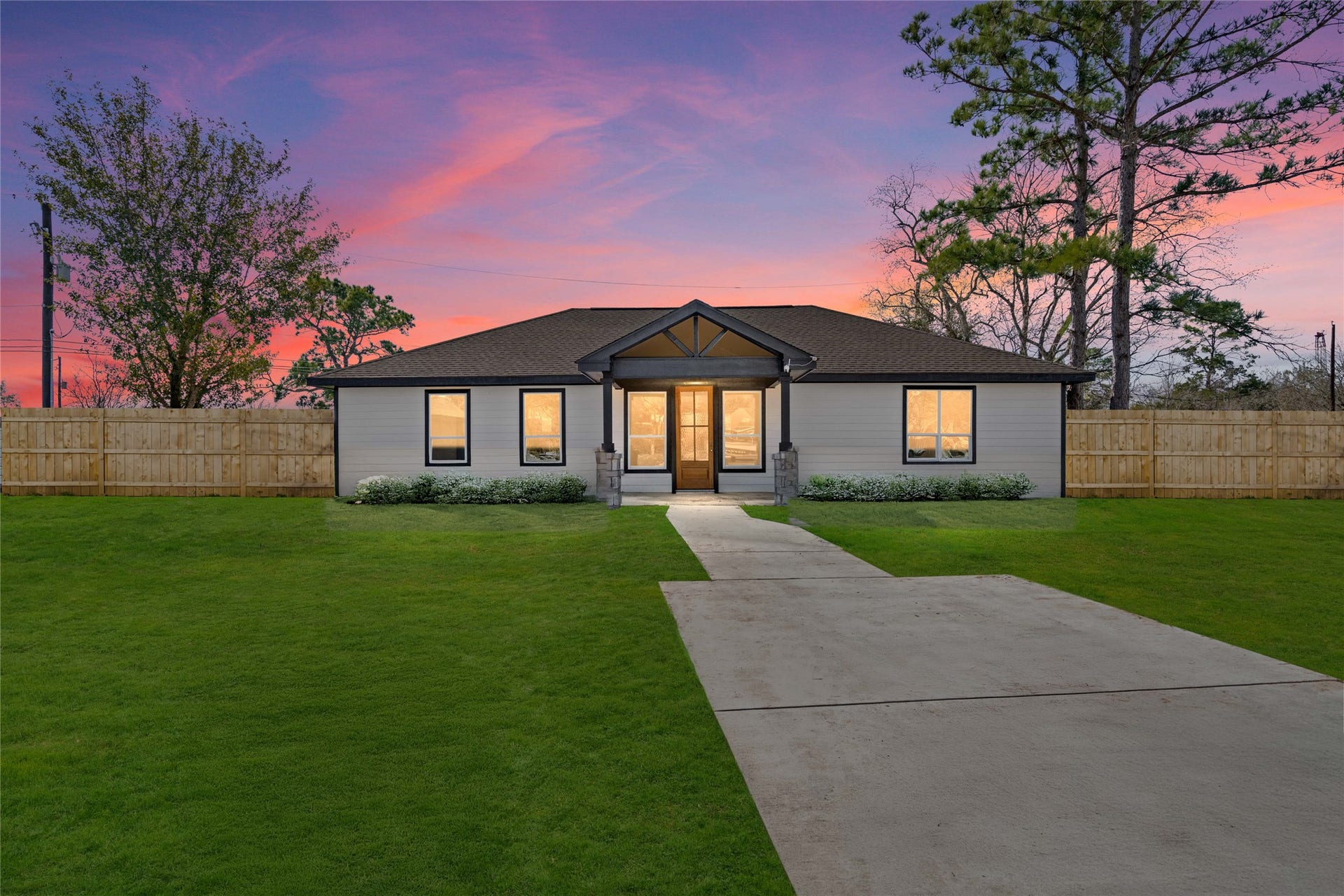 Welcome to 4654 N Teague
Street. Stunning newly built
home, highlighting its
modern faade and
expansive lawn. welcoming
pathway leads to a striking
front entry, promising
elegance and comfort from
the moment you arrive.