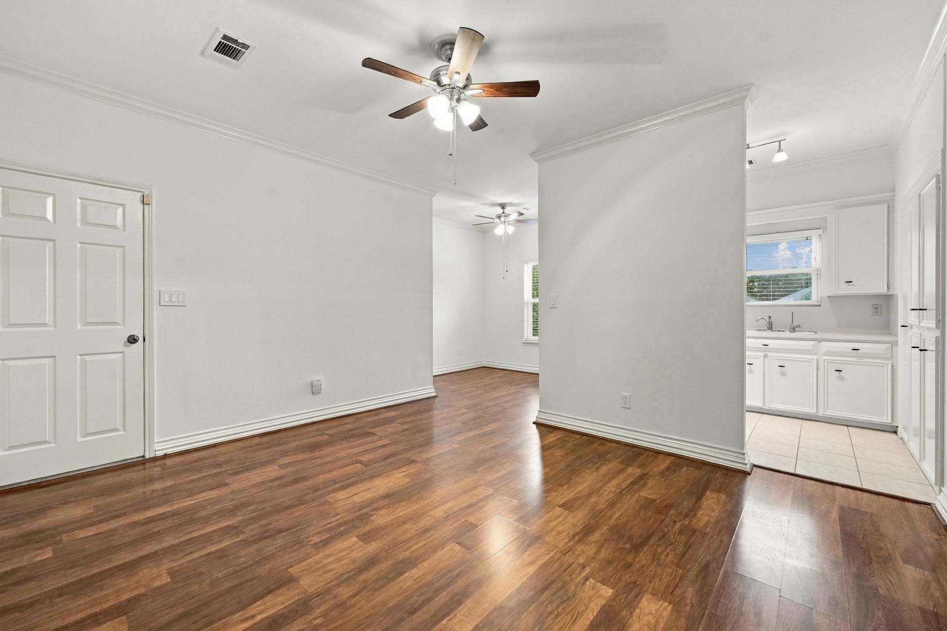 1430 Stependale Drive, Katy, TX 77450 Garage Apt-Private Entrance-Bright Livingroom plus Den/Office with wood-look flooring, a ceiling fan, and a window overlooking the surrounding area.