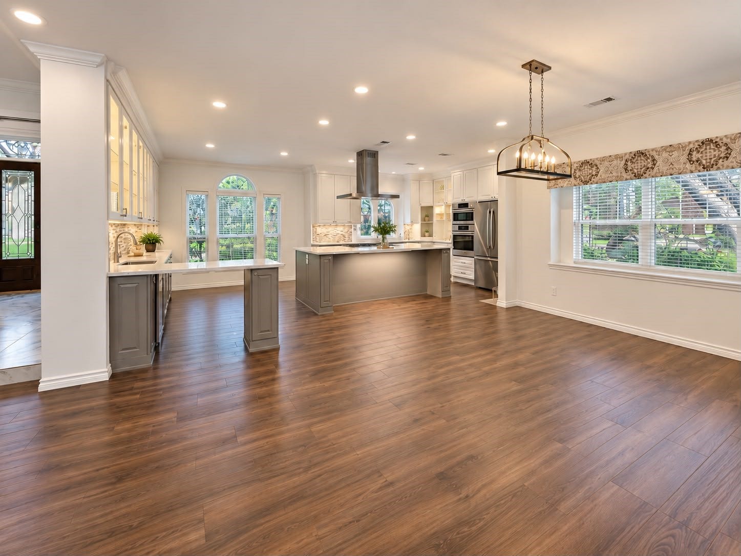1430 Stependale Drive, Katy, TX 77450 Open layout showcasing the kitchen, breakfast area, and adjoining living space with modern flooring.