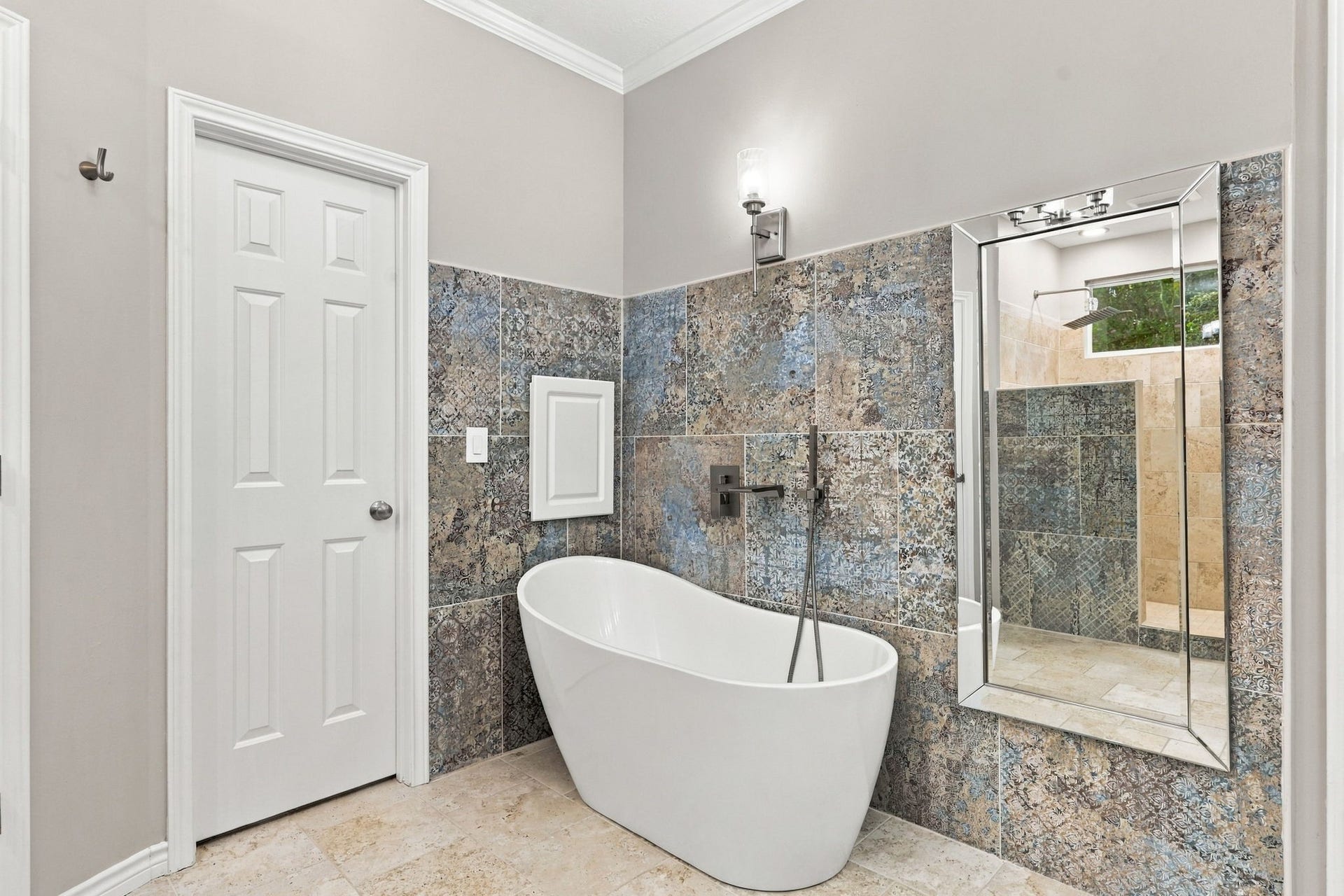 1430 Stependale Drive, Katy, TX 77450 Well-appointed bathroom featuring a freestanding soaking tub, dual vanity, and decorative tile accents.
