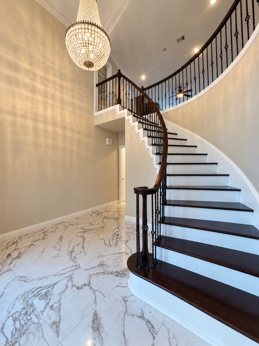 1430 Stependale Drive, Katy, TX 77450 Bright entryway showcasing a curved staircase, elegant railing, and a spacious adjoining area.