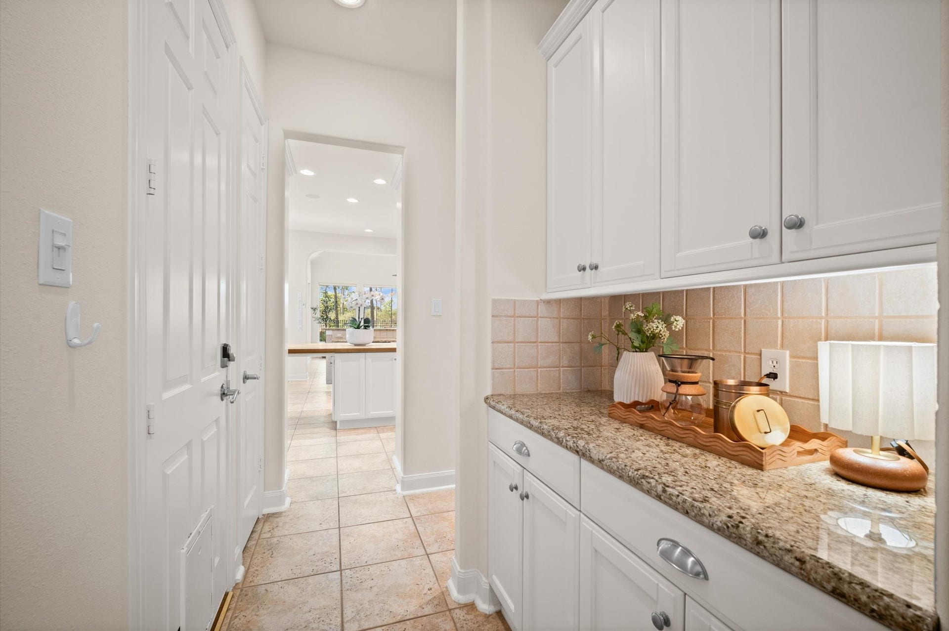 3010 Bonnebridge Way Boulevard, Houston, TX 77082 The butlers pantry creates a seamless connection between the kitchen and dining room, with generous storage and convenient serving space
