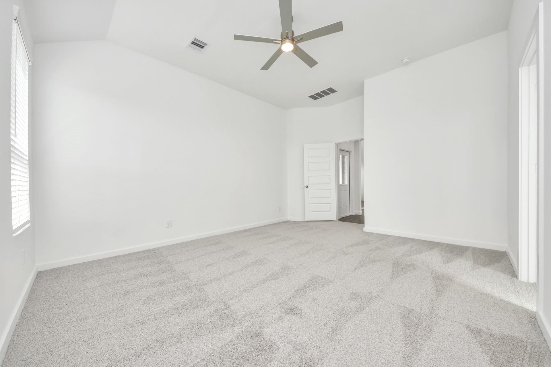 5822 Madison Trail Drive, Richmond, TX 77469 Escape to tranquility in this spacious primary room, adorned with plush carpeting and bathed in the soothing hues of warm paint colors, creating a cozy retreat for relaxation. Sample photo of completed home with similar floor plan. Actual colors and selections may vary.