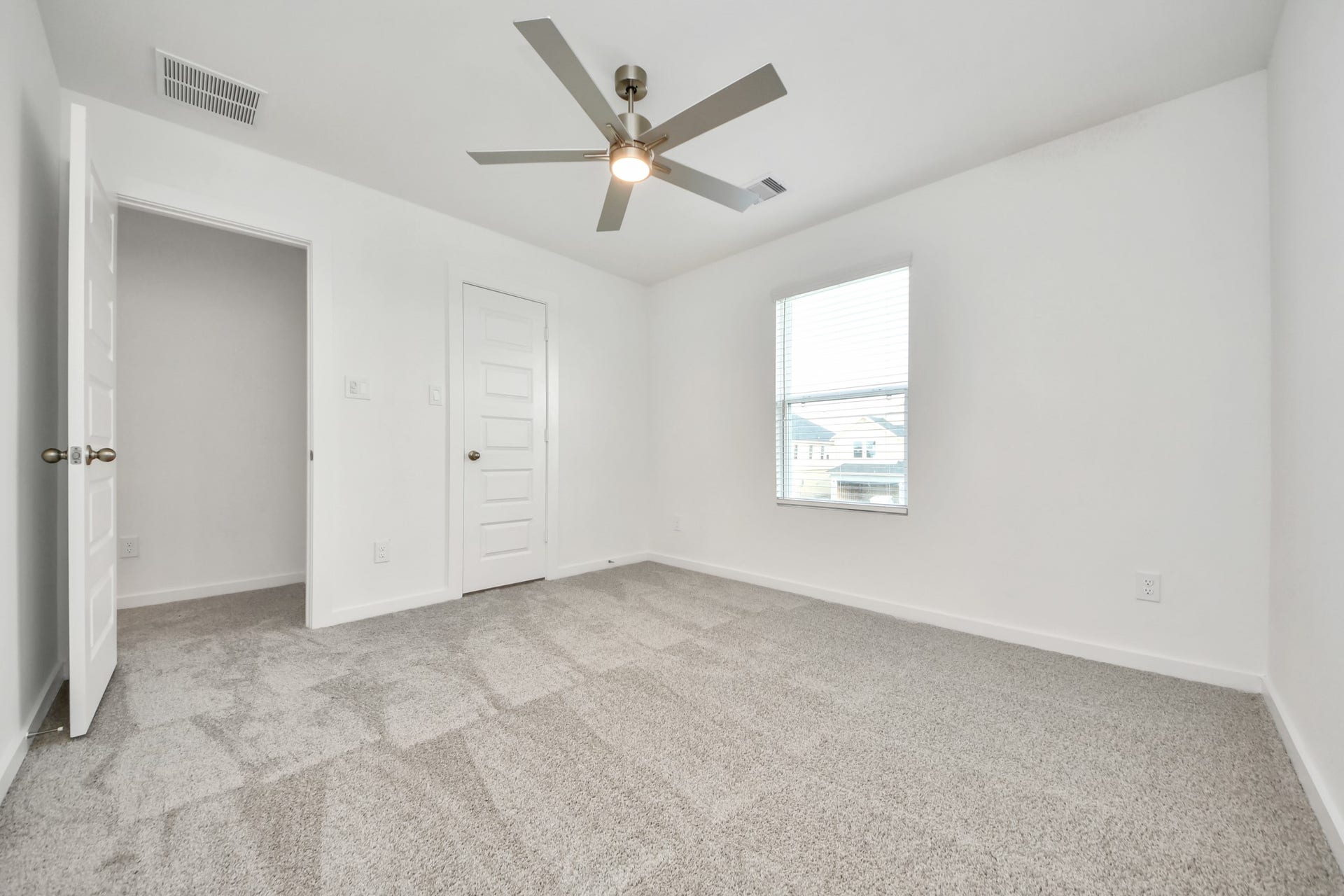 5822 Madison Trail Drive, Richmond, TX 77469 Generously sized secondary bedrooms featuring spacious closets, soft and inviting carpeting underfoot, large windows allowing plenty of natural light, and the added touch of privacy blinds for your personal retreat. Sample photo of completed home with similar floor plan. Actual colors and selections may vary.