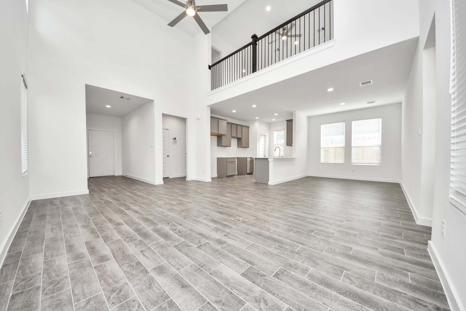 5822 Madison Trail Drive, Richmond, TX 77469 Take another glimpse into the heart of the home with this additional view of the family rooma sprawling space ready to accommodate all your gatherings. Sample photo of completed home with similar floor plan. Actual colors and selections may vary.