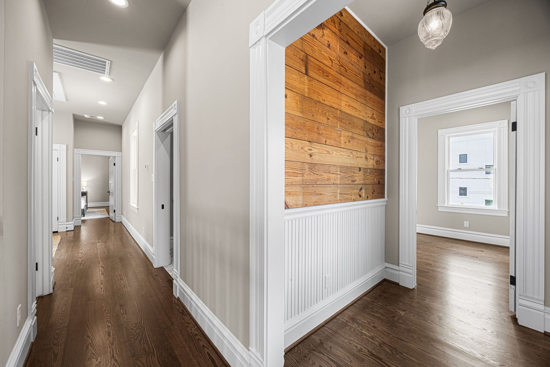 2nd floor hallway/stairwell landing.  Upstairs you will find 3 bedrooms, a 2nd living room, nice size balcony and laundry room.