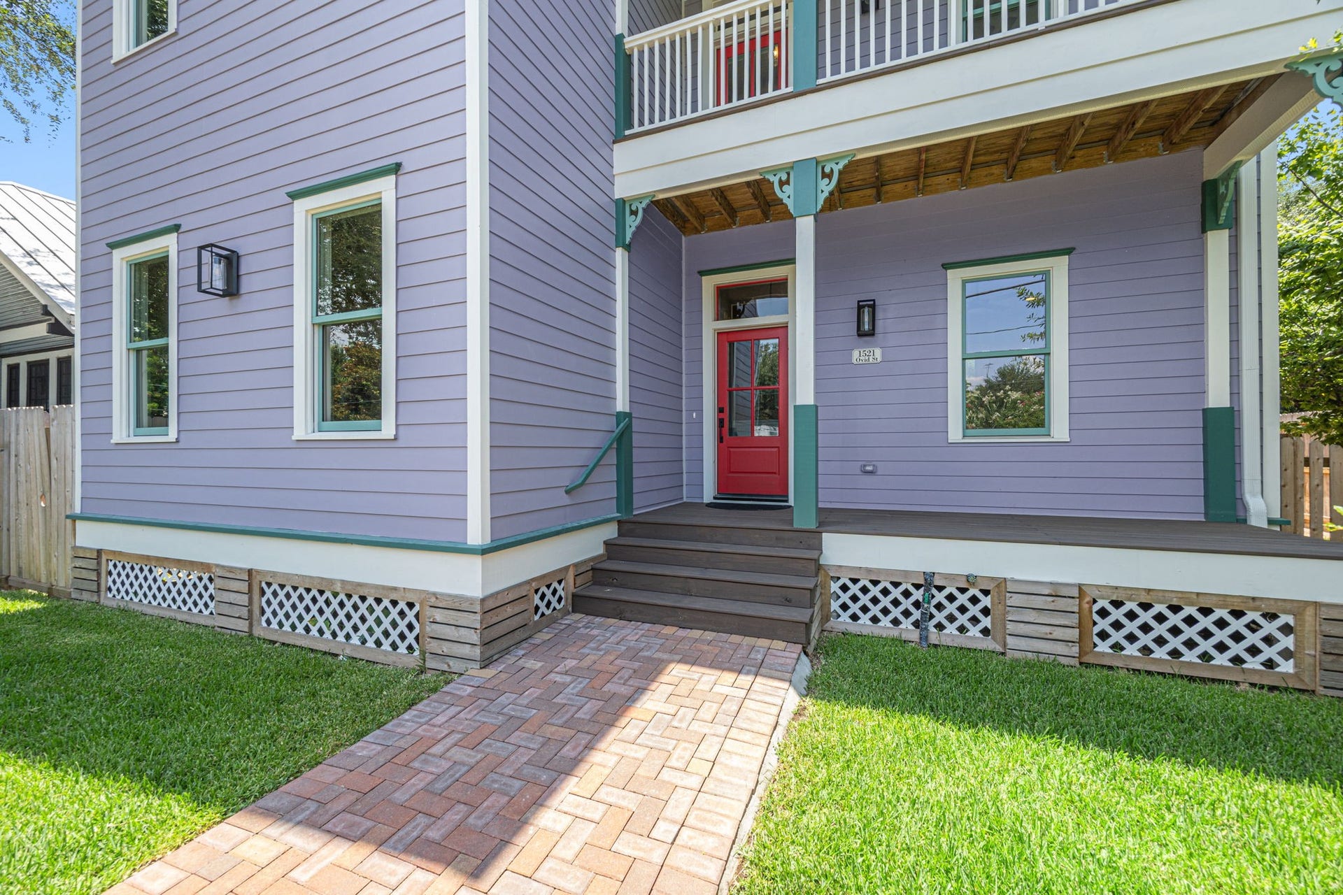 The pavered patio leads to the welcoming front porch, a perfect spot to welcome your guests.