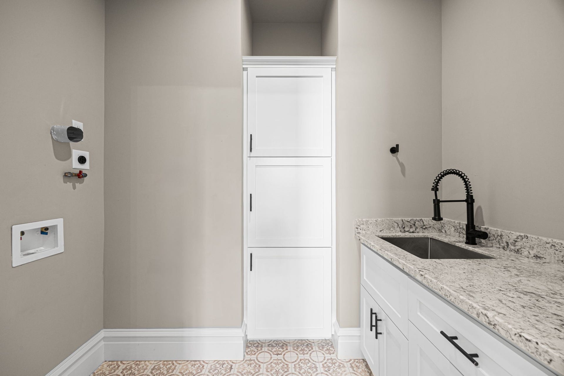 The 2nd floor laundry is equipped with gas or electric connections. Built-in storage, as well as a sink make the laundry a versatile space that has truly been maximized!