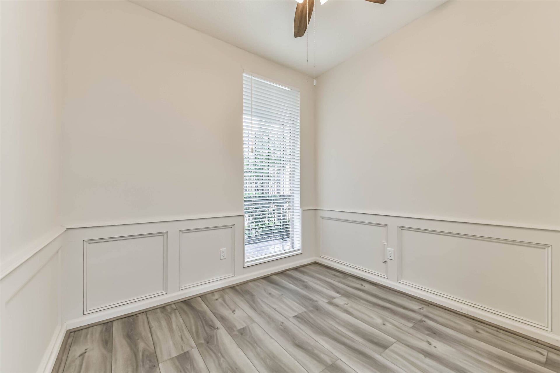 There is a cozy room downstairs that can be used as a study/office with luxury vinyl plank floors.