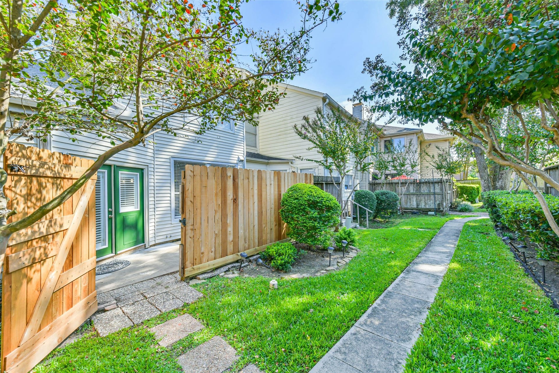 The patio opens to the courtyard where you can talk a stroll through the community.