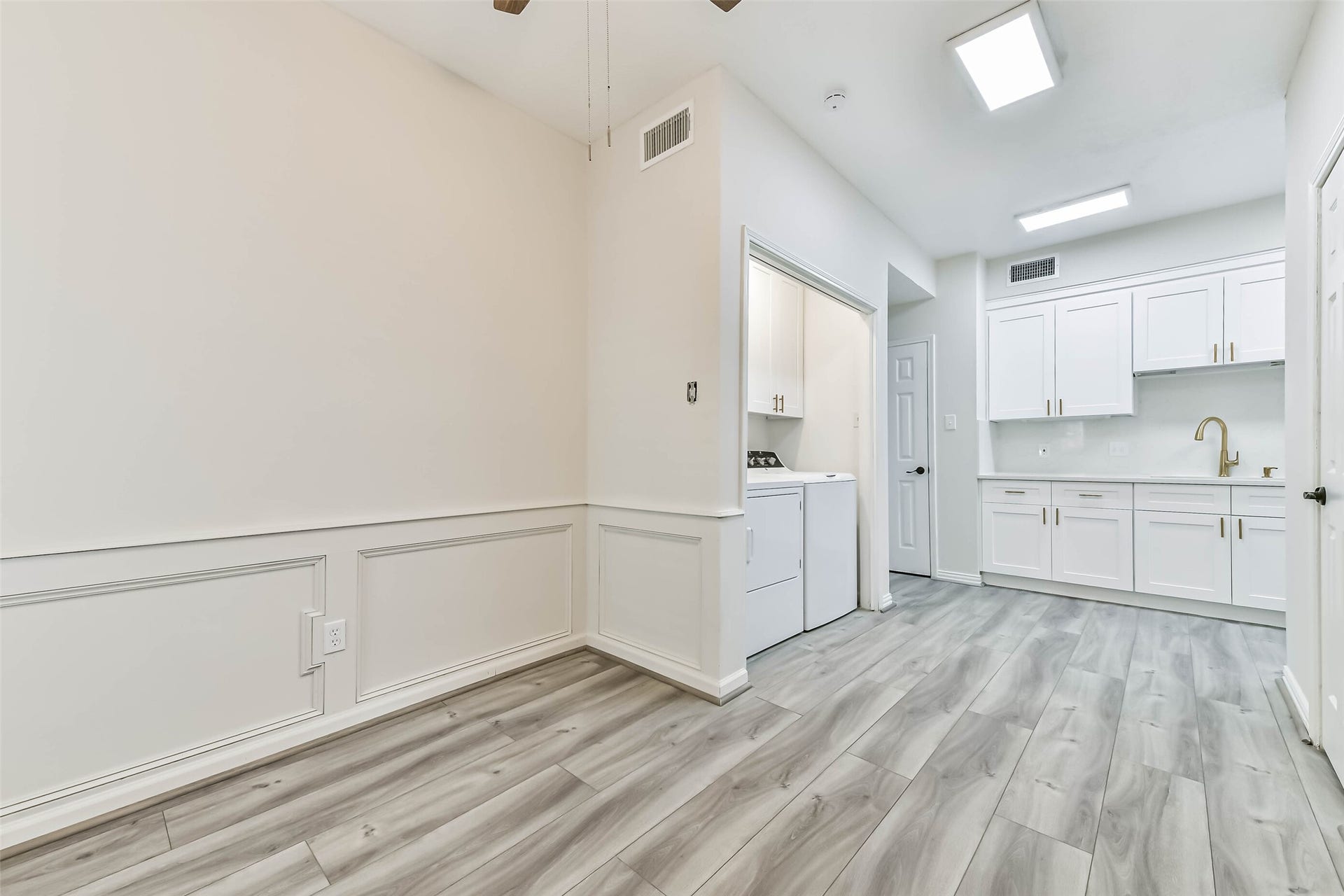 A different angle of the office/study looking towards the extended kitchen and utility closet.